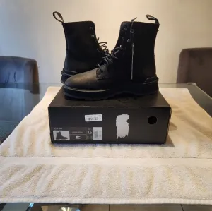 Black Leather Combat Boots with Lace-Up Design