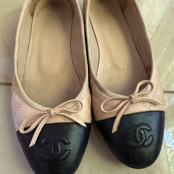 CHANEL Cream and Black Flats Timeless Elegance