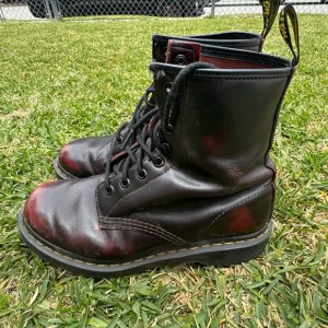 Dr. Martens Black and Red Combat Boots with Iconic Stitching