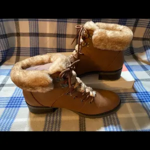 NIB fuzzy lace up boots. Women’s 10