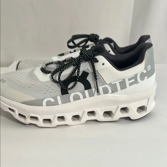 On Running White and Black Athletic Shoes with CloudTec Cushioning