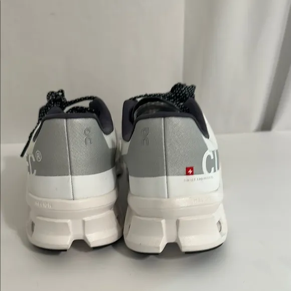 On Running White and Black Athletic Shoes with CloudTec Cushioning