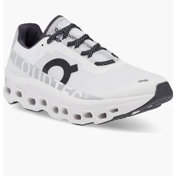 On Running White and Black Athletic Shoes with CloudTec Cushioning
