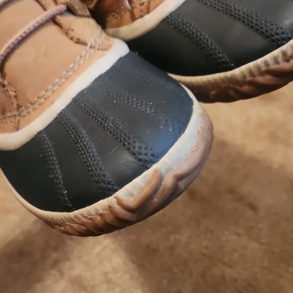 Sorel Out N Obout Tan and Black Lace-Up Boots